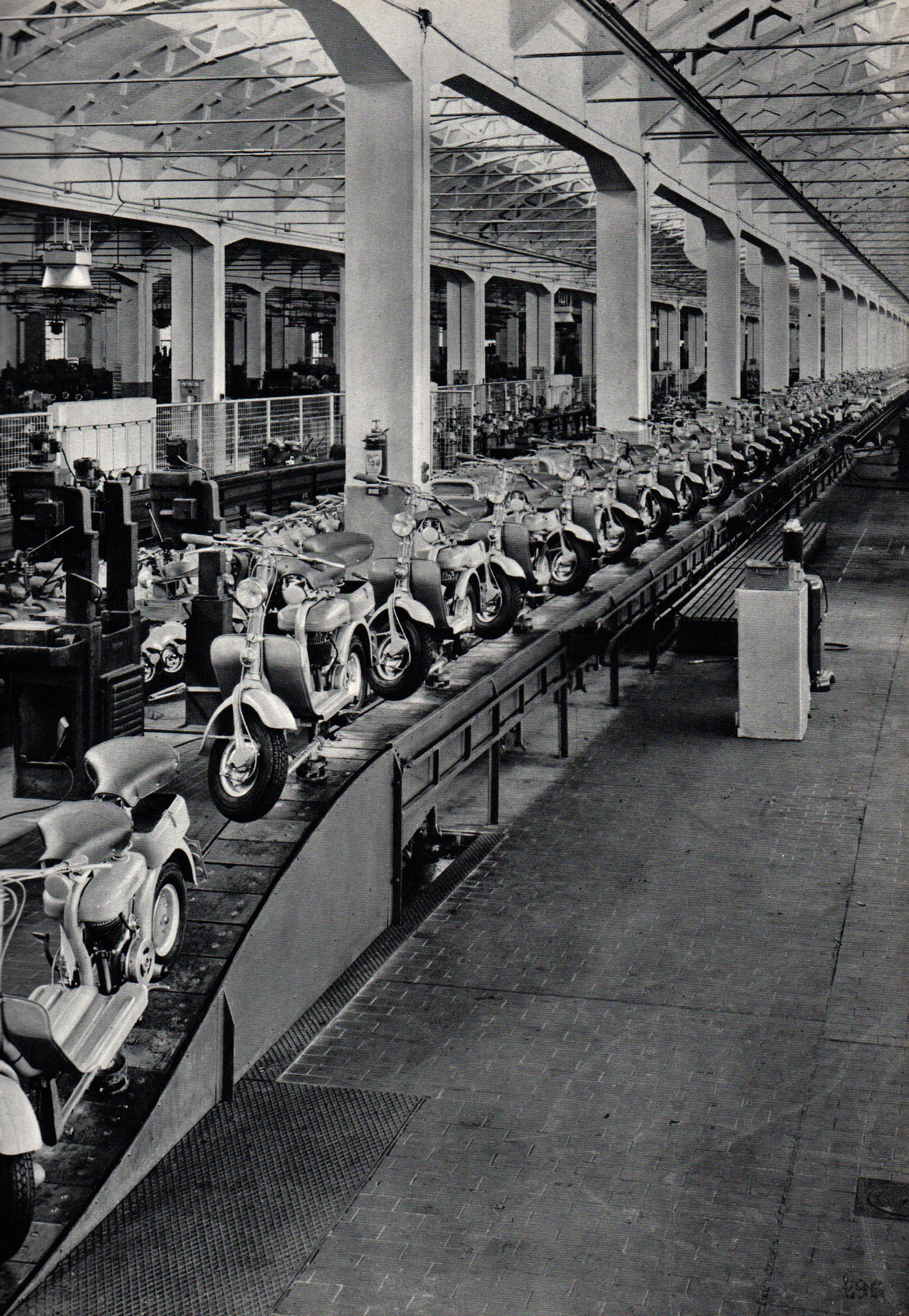 Completed Lambretta scooters at the end of the final assembly line inside the Innocenti Works
